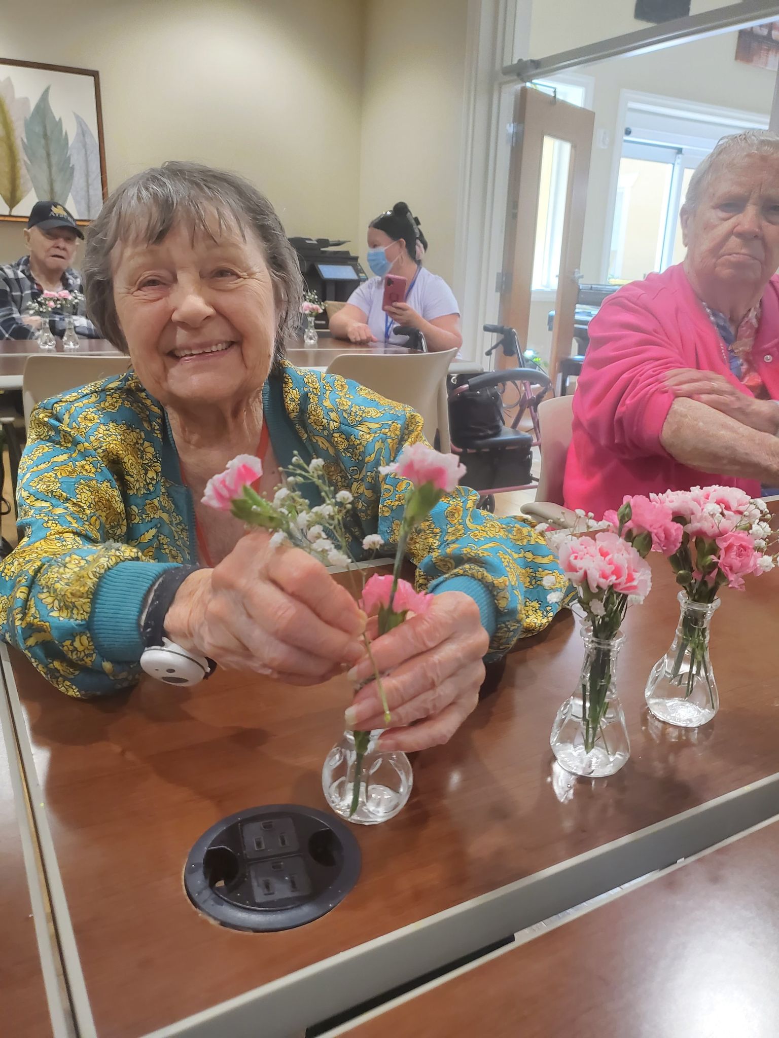 memory care activity - arranging flowers - Dorothy arranging flowers