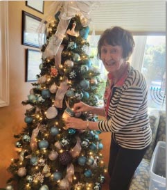 memory care resident decorating tree