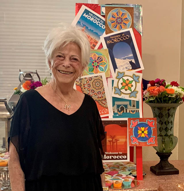 assisted living resident betty smiling with clown