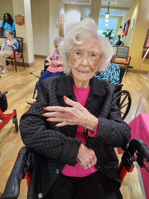 memory care resident showing her bracelets