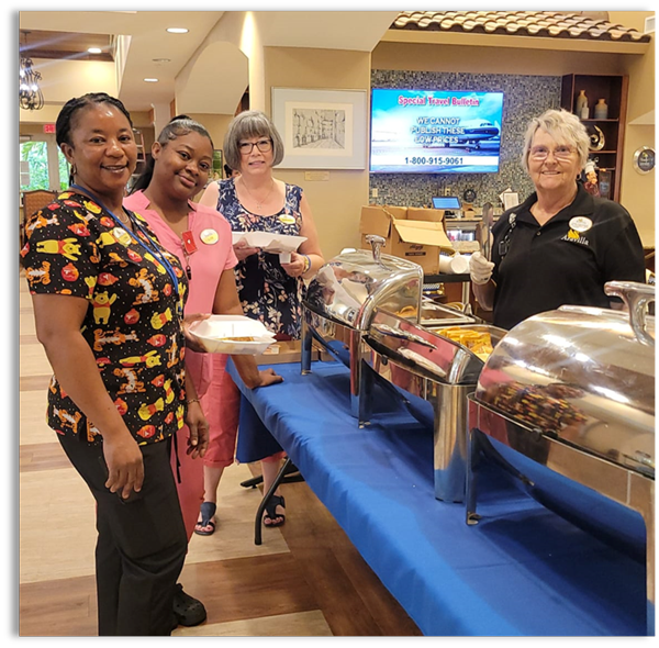 Aravilla memory care staff having buffet ready