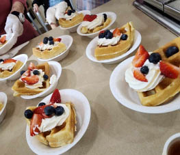 memory care residents made waffles for the celebration in their cooking class