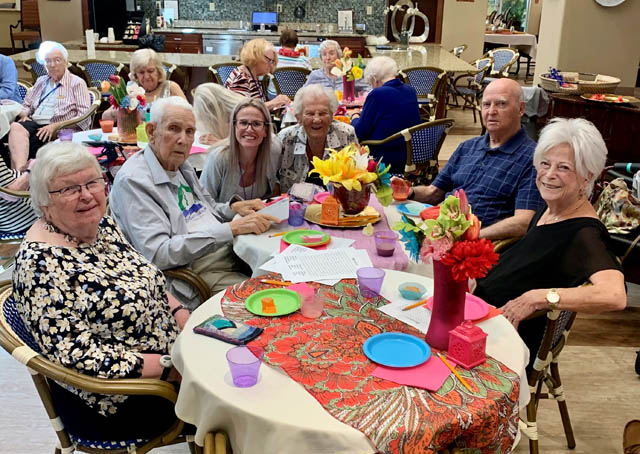 assisted living residents enjoying happy hour