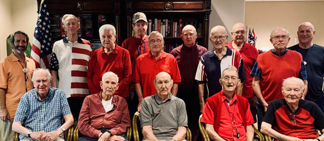 assisted living residents posing for group picture