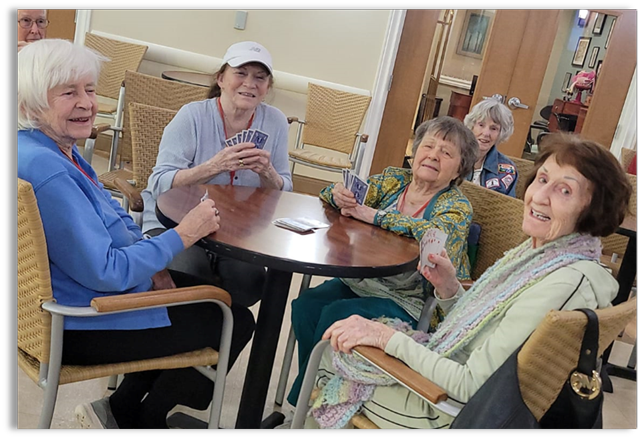 memory care residents playing cards