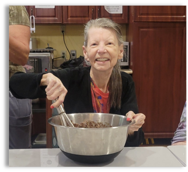 Patricia baking at Aravilla Sarasota Memory Care