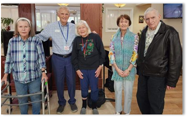 group of memory care residents ready for worship