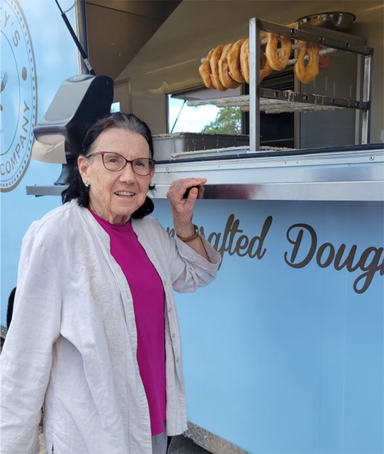 Nancy getting a donut memory care outing Aravilla Sarasota