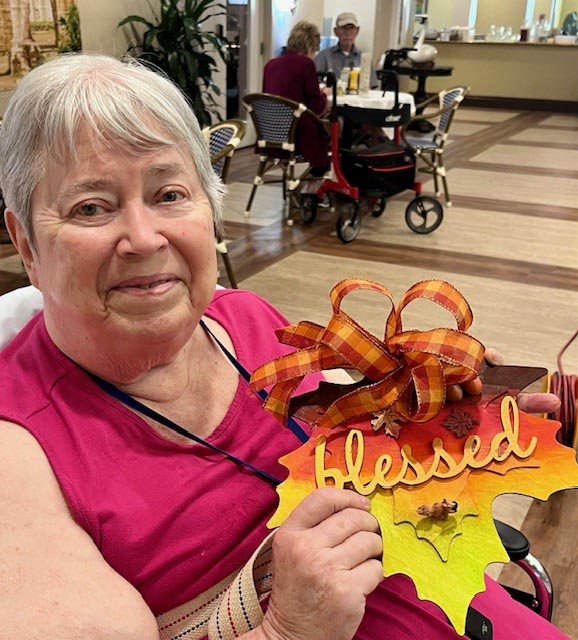 assisted living resident with fall crafts