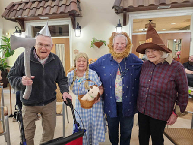 memory care residents dressed in Halloween costumes