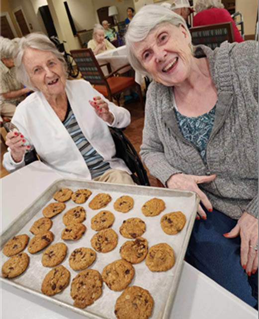 memory care residents baking cookies