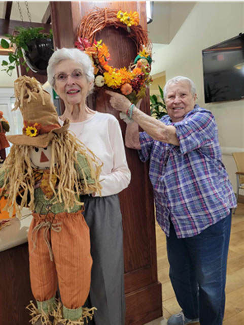 memory care residents with Fall decorations