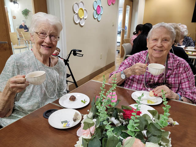 happy memory care residents at tea party happy memory care residents at tea party