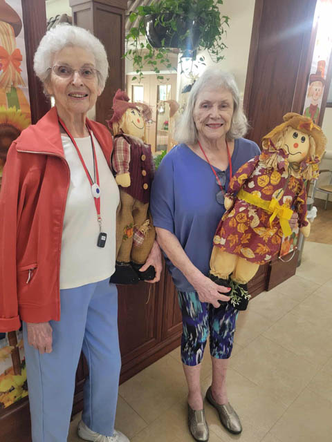 happy memory care residents picking out Fall decor happy memory care residents picking out Fall decor