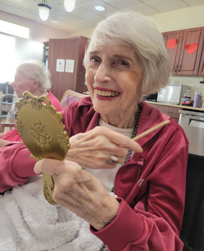 senior smiling with new haircut
