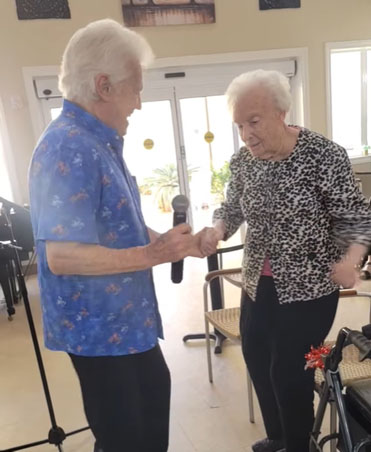 senior resident with microphone