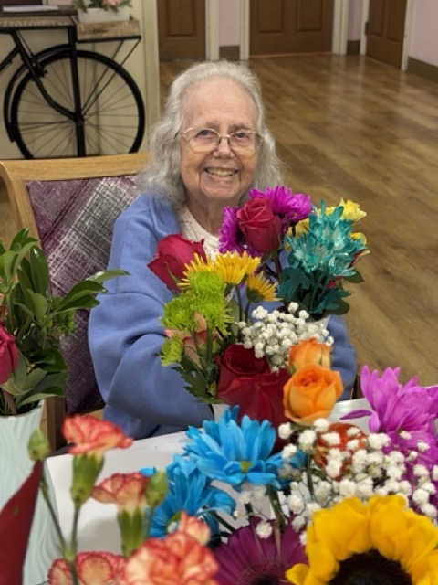 memory care resident makin flower arrangements